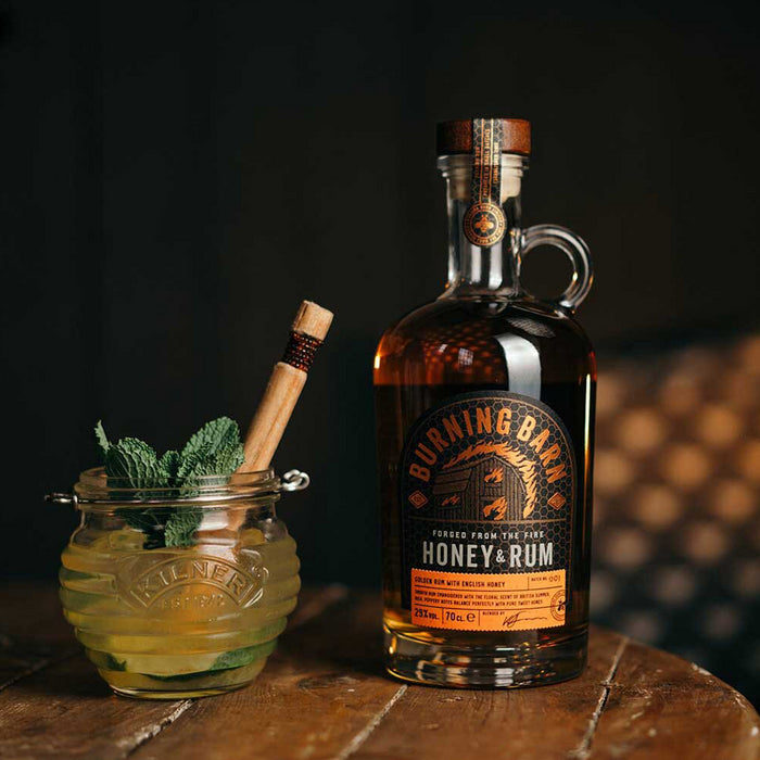 Burning Barn Honey & Rum bottle with a cocktail