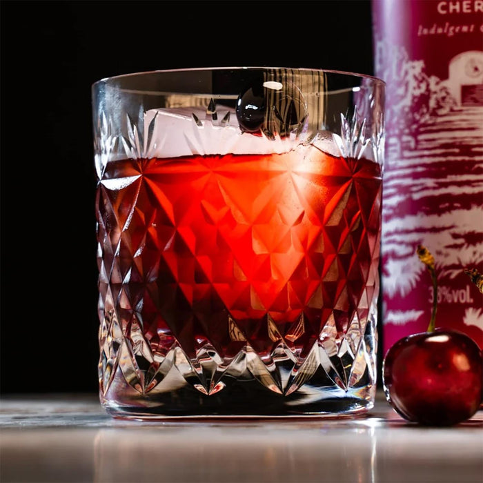 Crystal glass filled with Dutch Barn Vodka Black Cherry cocktail