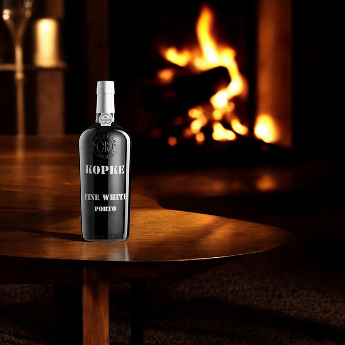 Bottle Of Kopke Fine White Port By An Open Fire 