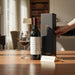 Bottle of Vega Sicilia Unico, a glass & Secret Bottle Shop gift box on a table