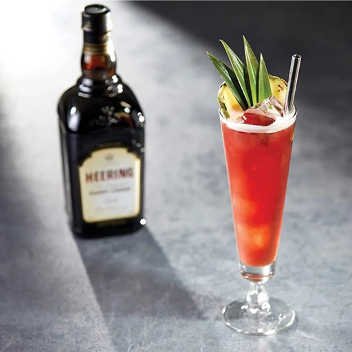 A Bottle Of  Heering Cherry Liqueur With A Cocktail 