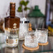 Bottle Of Wild Arbor Clear Cream Liqueur & Glasses