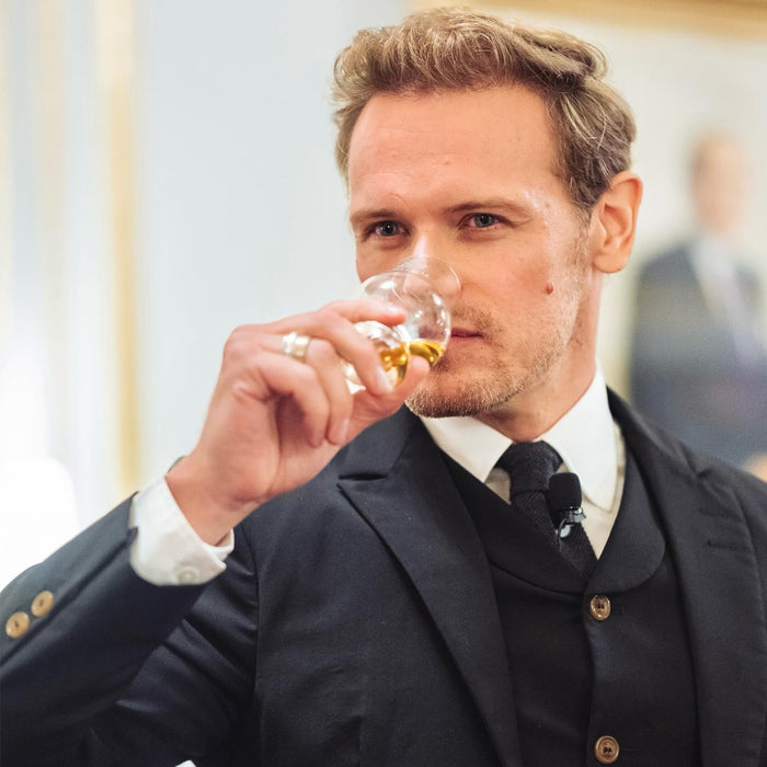 Sam Heughan Drinking Whisky