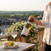 Person enjoying Joseph Drouhin Macon Villages on a balcony