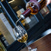 Pouring Penderyn Sherrywood Finish Single Malt Welsh Whisky Into Glass