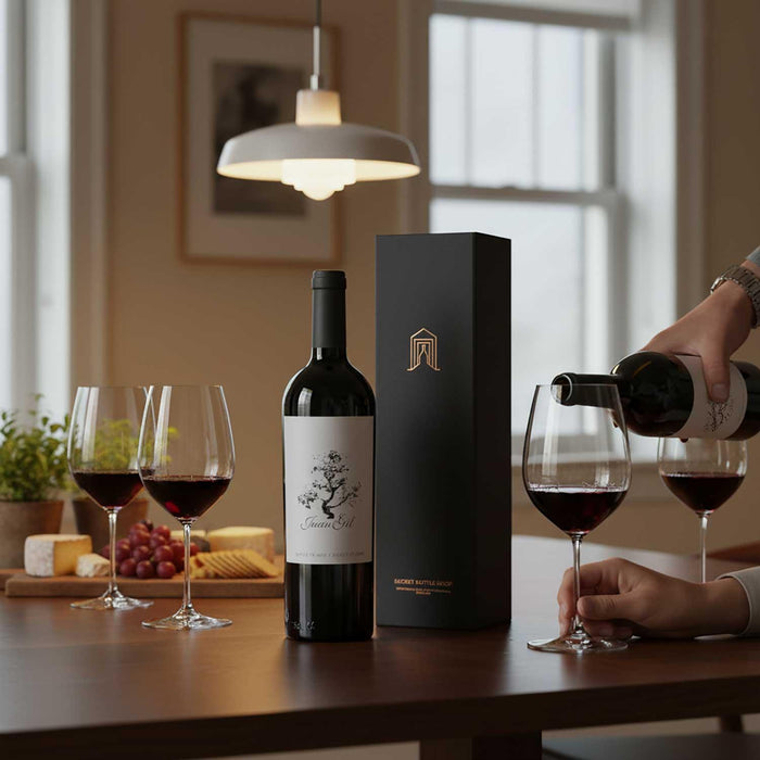 Wine bottle, glasses, and Secret Bottle Shop wine gift box