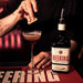 Bartender Making Cherry Heering Liqueur Cocktail