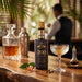 Bottle of Angostura Bitters 200 on a bar with a cocktail glass and decanter.