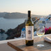 Anhydrous Afoura Santorini Assyrtiko with a view of Santorini