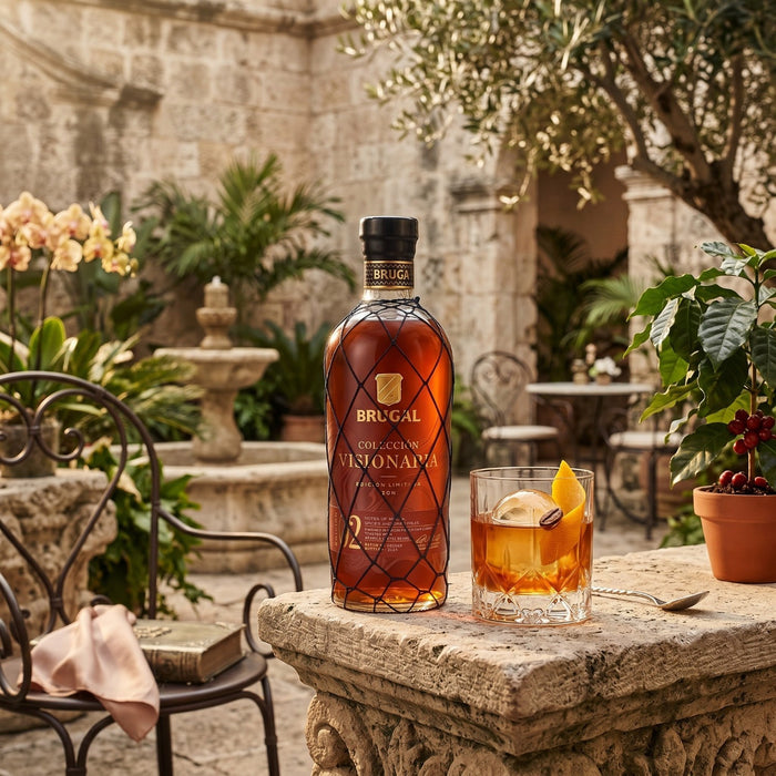Bottle with Brugal with a old fashioned in a garden.