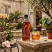 Bottle with Brugal with a old fashioned in a garden.