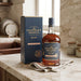 Chairman's Reserve Rum bottle and box on a marble surface with kitchen background