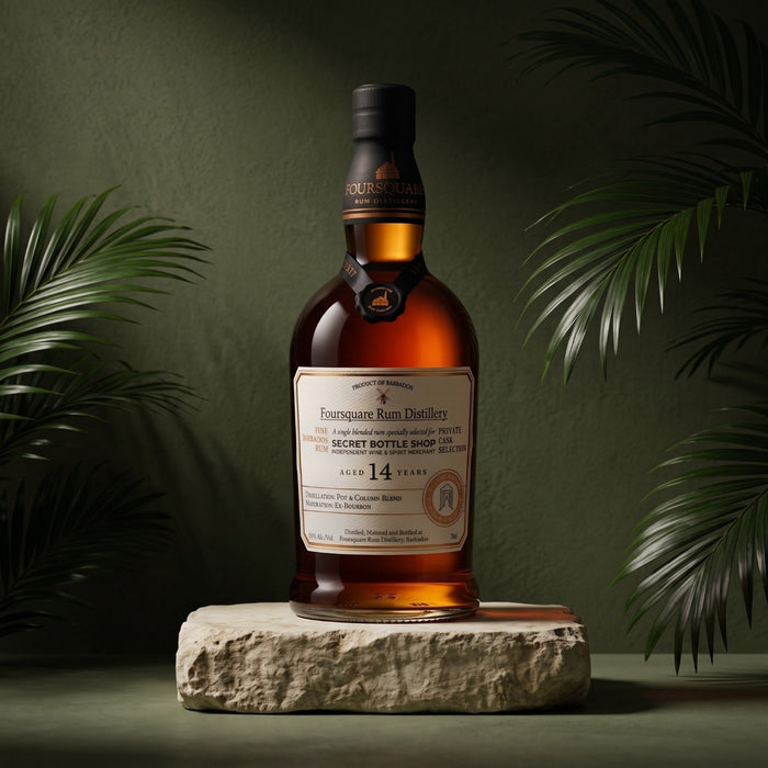 
Foursquare 14 Year Old Rum Secret Bottle Shop Exclusive Private Cask Selection stands on a rough stone pedestal against a dark olive green background with tropical palm leaves framing the scene.