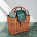 Wicker picnic basket with a green blanket and 'Graham's' branding on a marble surface.