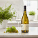 Le Domaine d'Henri Chablis Saint Pierre with a glass and grapes