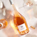 Rose wine bottle with 'Maéa' label on a light background