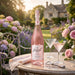 Rozel Rose Vodka in a garden with cocktails and flowers