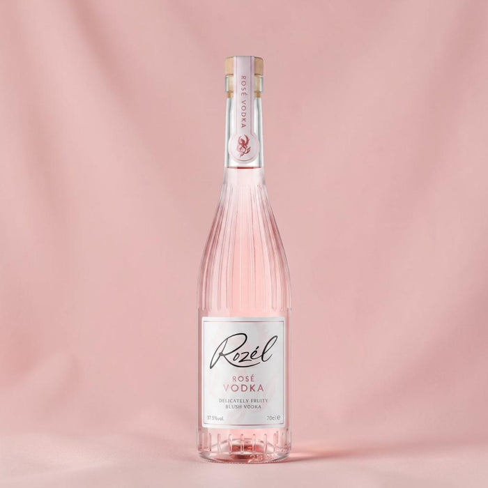 Rozel Rose Vodka in a studio with a pink backdrop.