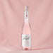 Rozel Rose Vodka in a studio with a pink backdrop.