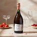Bottle of Savian Prosecco Rosé on a table with glasses and fruit