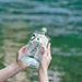 Roku Gin bottle with green label on a white background