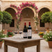 Taste of Lebanon Red Wine Duo with two glasses of red wine in a courtyard.