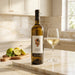 Tenuta Scuotto Campania Falanghina in the kitchen with a glass of white wine.