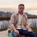 Sam Heughan with a bottle of The Sassenach Wild Scottish Gin