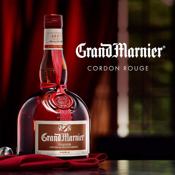 Bottle Of Grand Marnier Cordon Rouge Liqueur With Red Curtain Background 