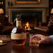 Blantons Original Single Barrel Bourbon with a glass.