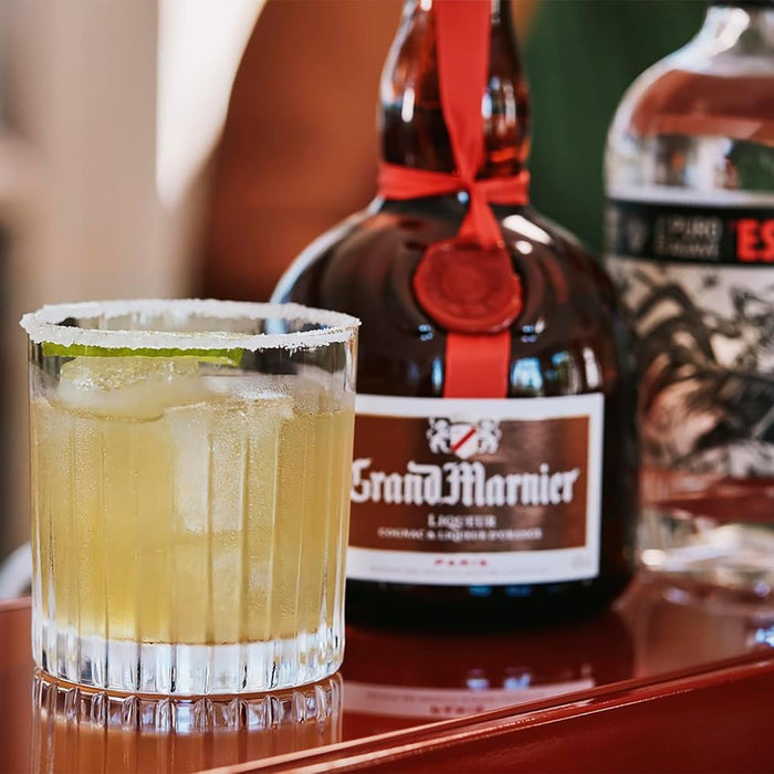 Grand Marnier Liqueur Bottle With Cocktail In Frosted Glass 