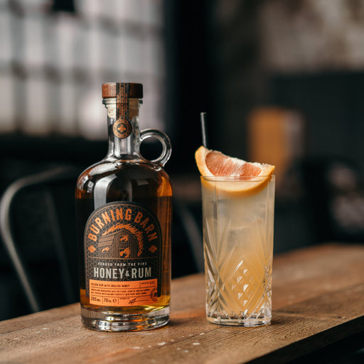 Burning Barn Honey Rum bottle with a cocktail