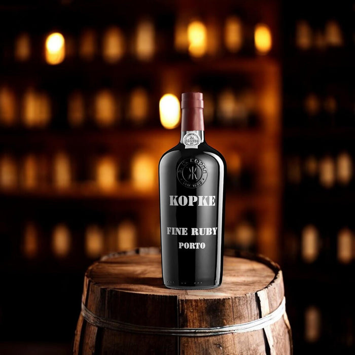 Bottle Of Kopke Fine Ruby Port On An Oak Barrel 