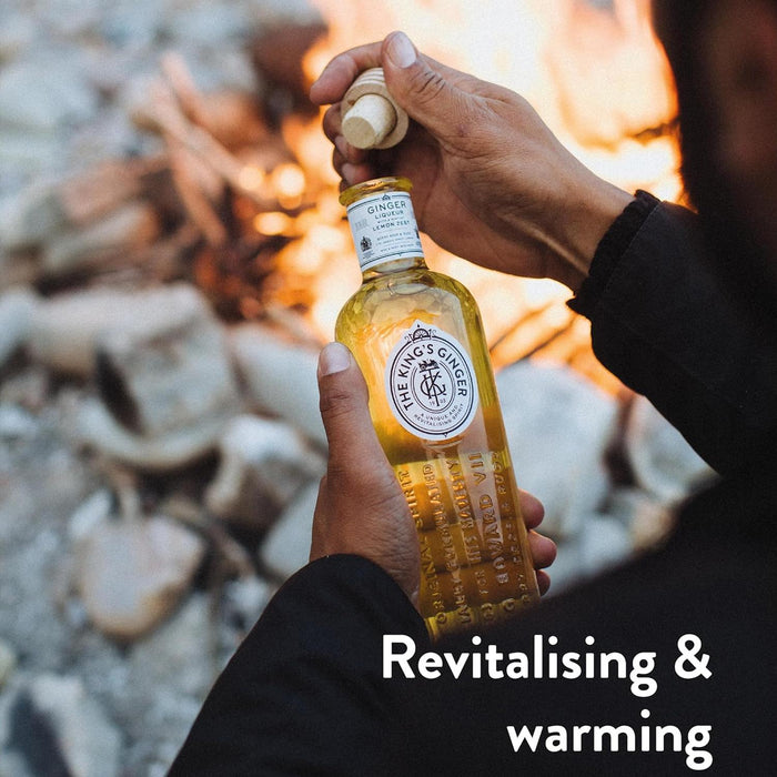 Enjoying The King's Ginger Liqueur By A Bonfire