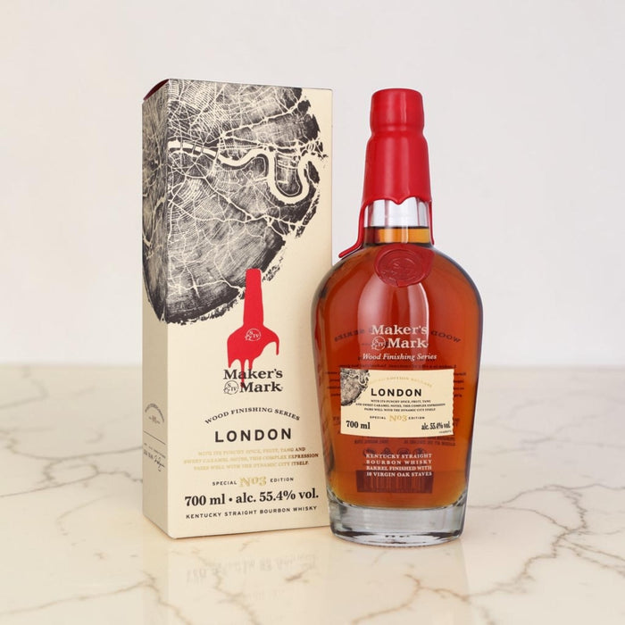 Maker's Mark London whiskey bottle and packaging on a marble surface