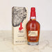 Maker's Mark London whiskey bottle and packaging on a marble surface