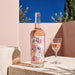 Chateau d'Esclans The Pale Rose with a glass of wine in an outdoor setting