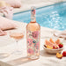 Chateau d'Esclans The Pale Rose with a bowl of fruit, glass of wine near the pool