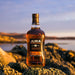 Jura 18 Year Old Whisky 70cl In Front Of Landscape