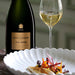 Bollinger R.D. 2008 Vintage Champagne And Wine Glass Next To Food