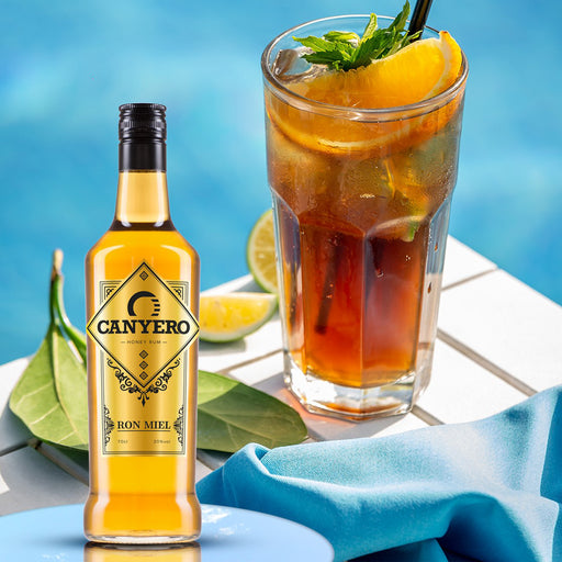 Canyero Ron Miel Honey Rum Liqueur Next To A Cocktail