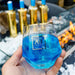 Glass of AU blue raspberry vodka with ice