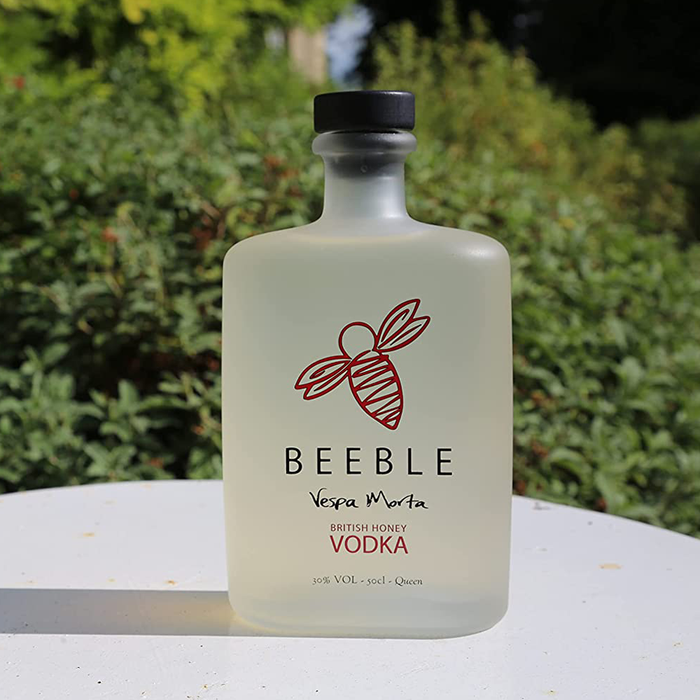 Beeble Honey Vodka on a table outside