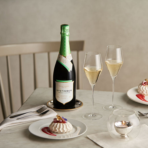 Nyetimber Cuvee Cherie Demi-Sec English Sparkling Wine 75cl And Two Wine Glasses On A Table With Dessert 