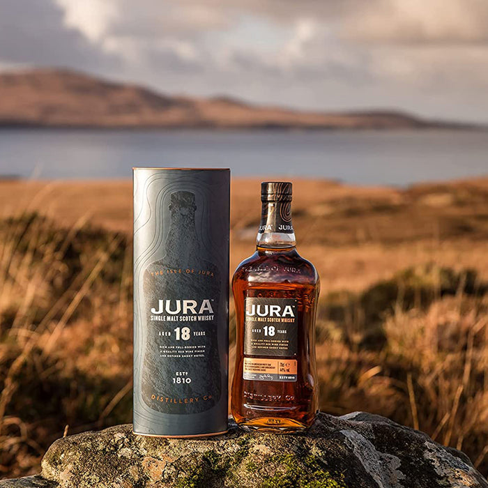 Jura 18 Year Old Whisky 70cl With Gift Box In Front of landscape 