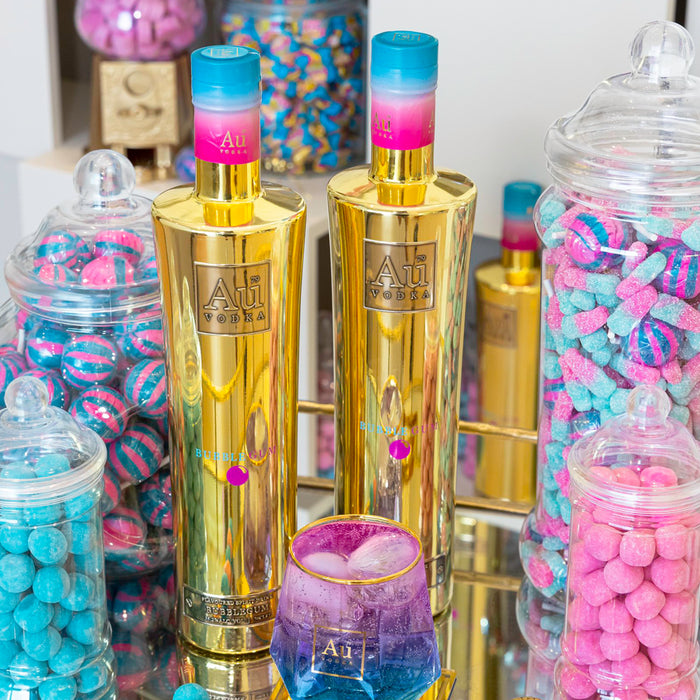 Au Bubblegum Vodka 70cl with jars of sweets and a cocktail