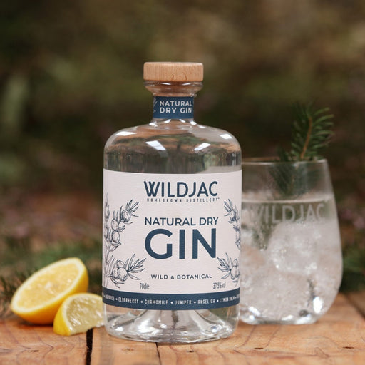 Wildjac Natural Dry Gin 70cl And A Glass In Front Of Landscape